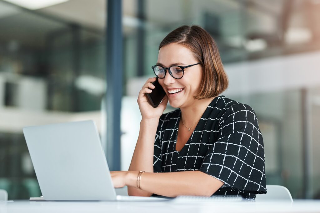 Smile,,Woman,And,Phone,Call,In,Office,With,Laptop,For